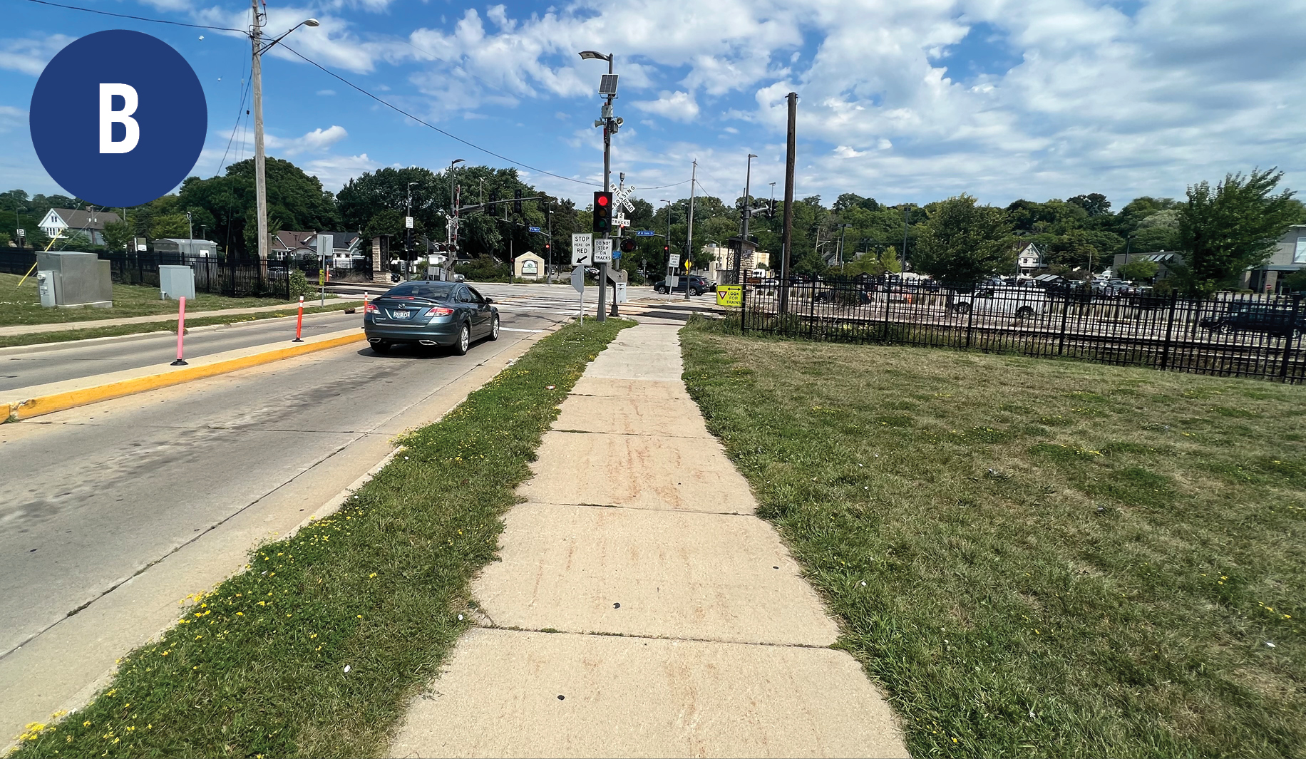 View of a pedestrian rail crossing from 10 yards before the rail